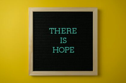 a letter board with message on a yellow surface