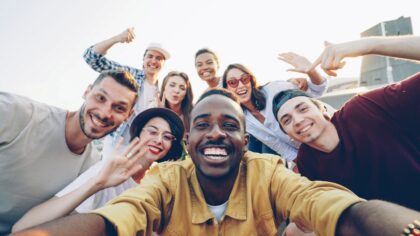 A diverse group of happy friends taking a selfie