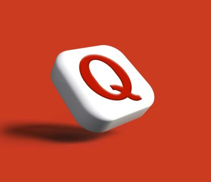 a white object with a red q on it