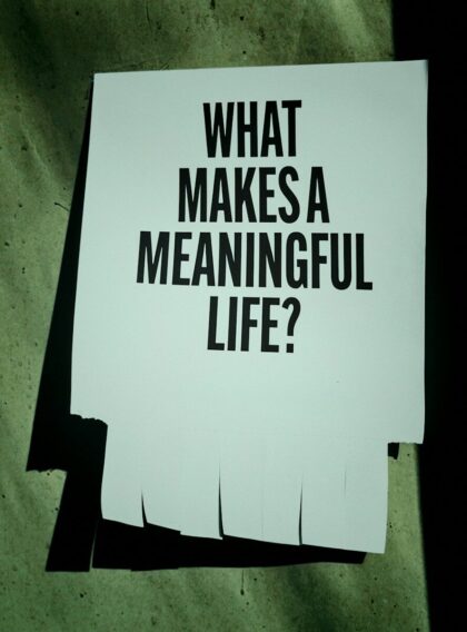 A paper with "what makes a meaningful life?" text